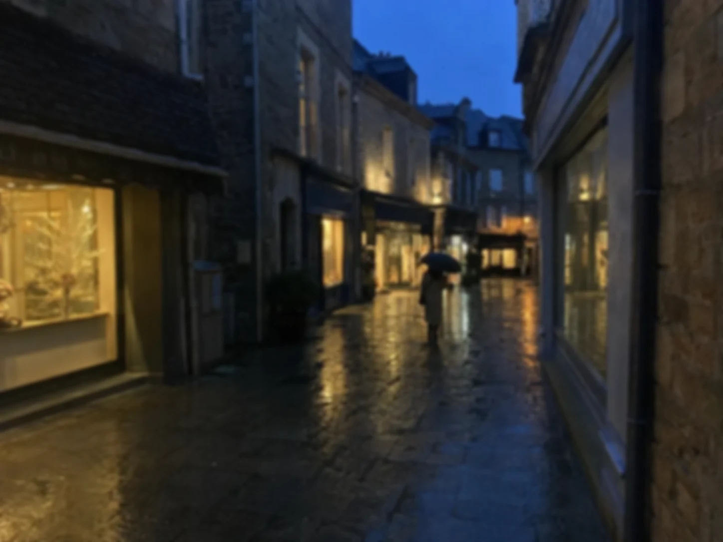 Noisy rainy-night travel photo before image enhancement