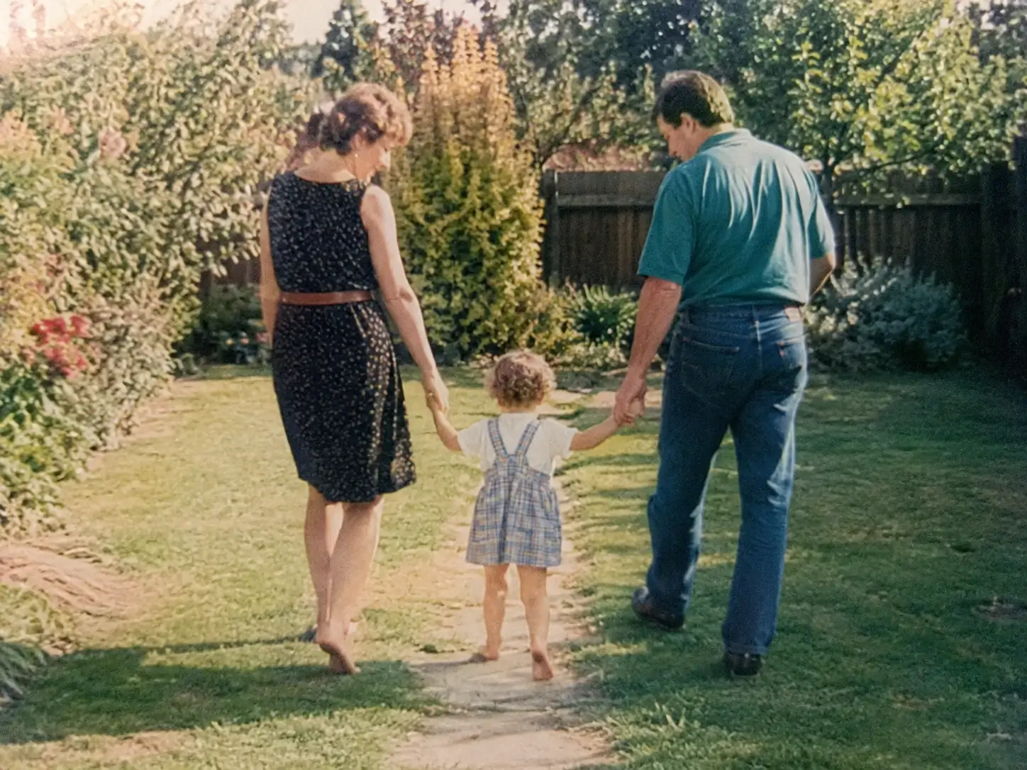 Faded family print with muted detail before photo enhancement